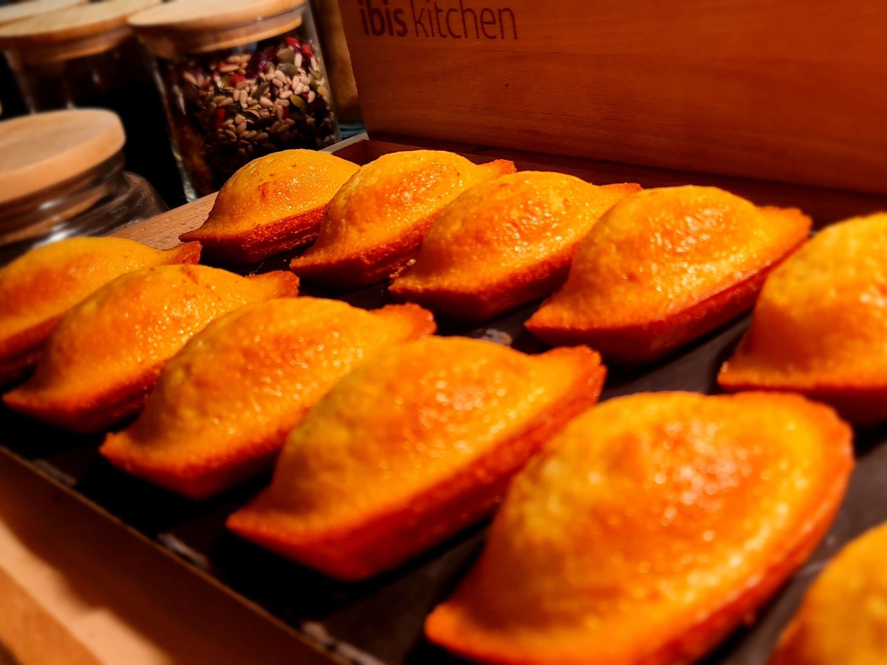 A tray of golden-brown pastries on a wooden surface.