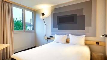 Premium bedding, desk, laptop workspace, soundproofing