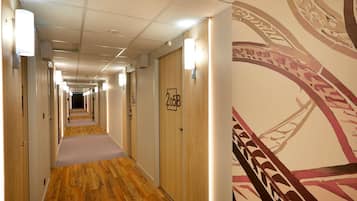 Premium bedding, desk, laptop workspace, soundproofing