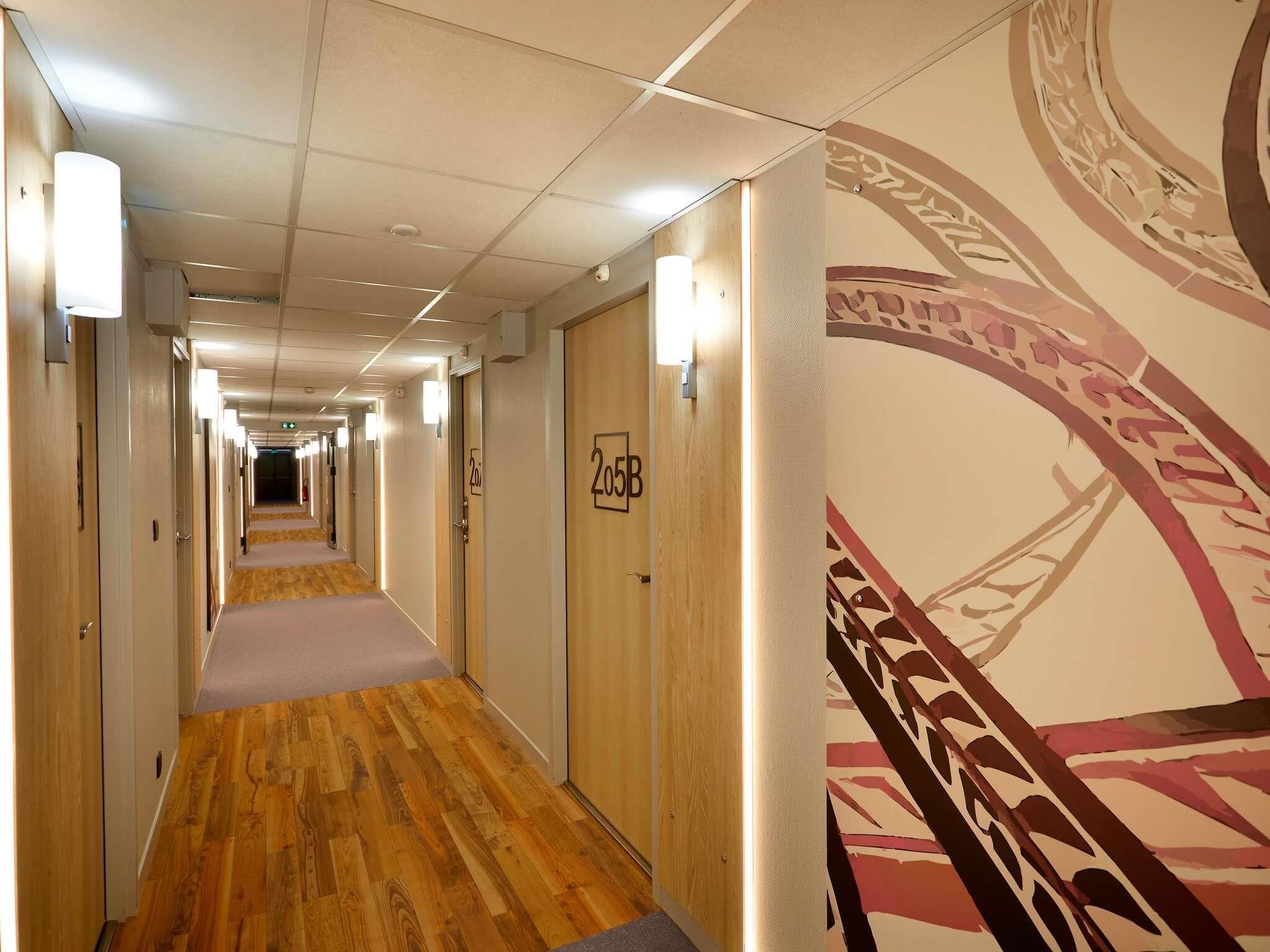 Premium bedding, desk, laptop workspace, soundproofing