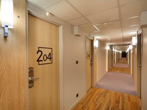 Premium bedding, desk, laptop workspace, soundproofing