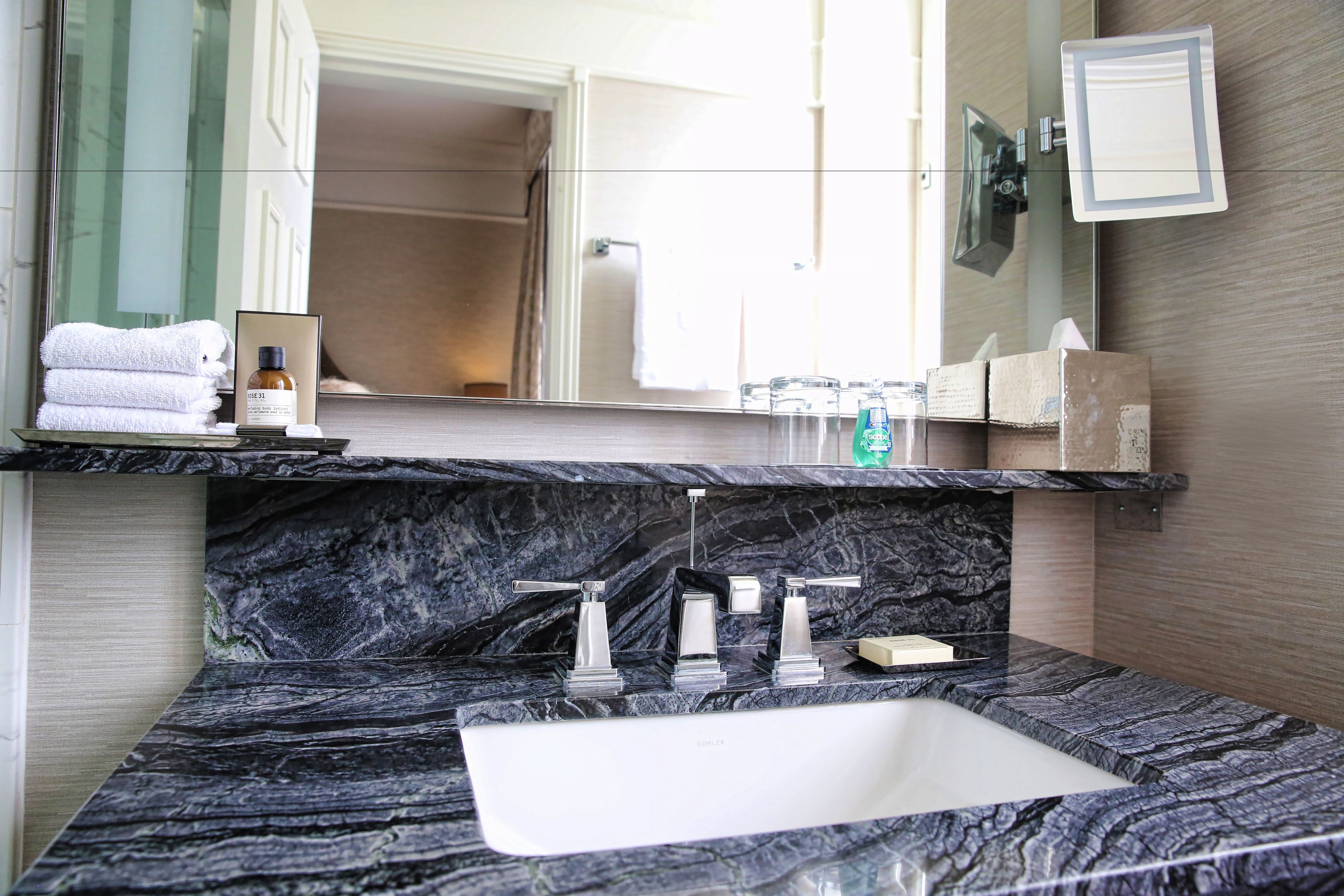 designer toiletries, hair dryer, bathrobes, slippers