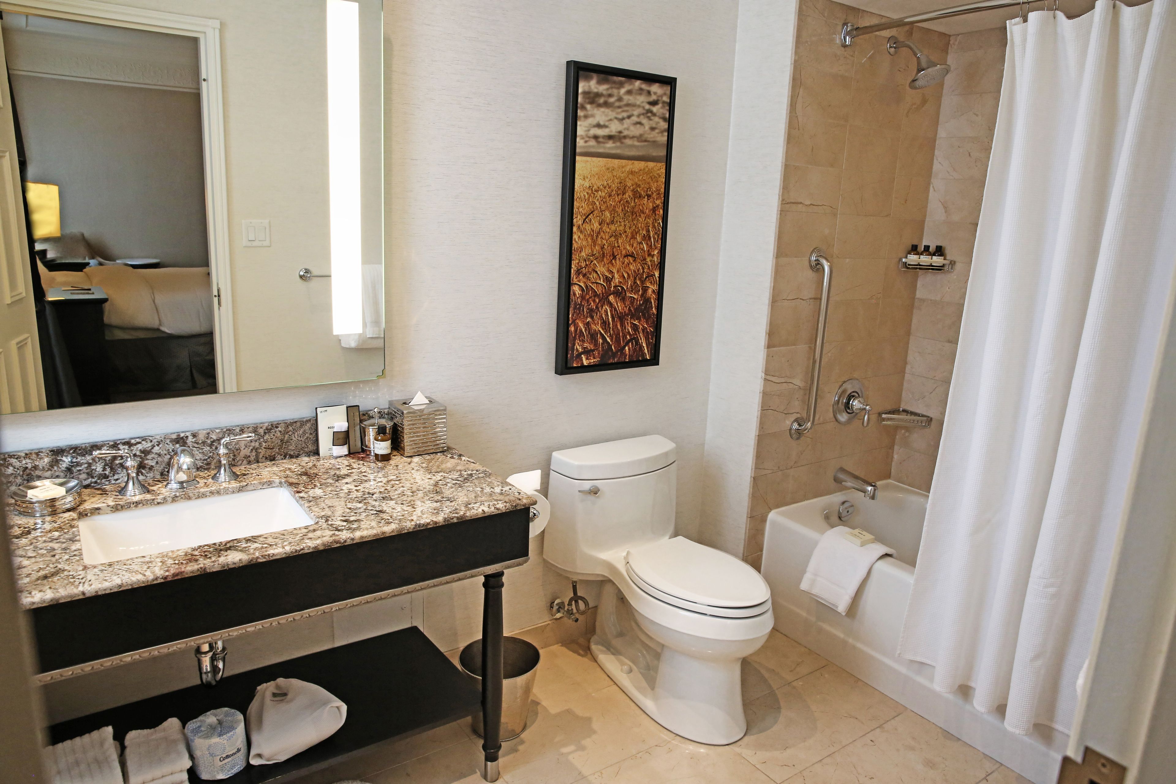 designer toiletries, hair dryer, bathrobes, slippers