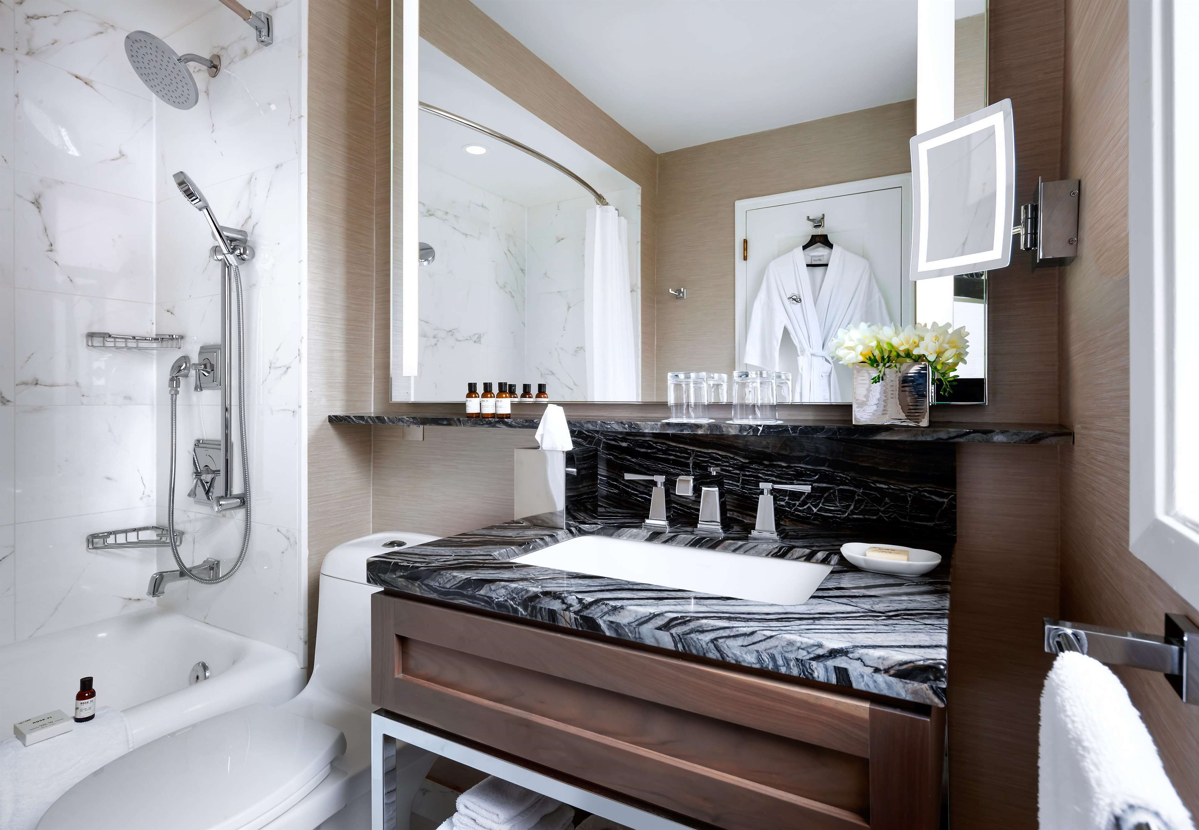 designer toiletries, hair dryer, bathrobes, slippers