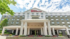 A Hilton Garden Inn with a symmetrical facade, large entrance, and a covered walkway. - Hilton Garden Inn Boston/Waltham (Waltham)