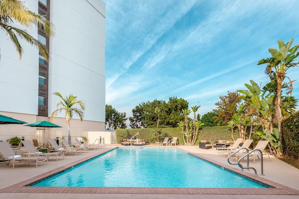 Outdoor pool, open 9:00 AM to 9:00 PM, pool loungers