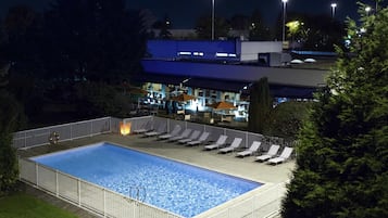 Seasonal outdoor pool, open 10:00 AM to 9:00 PM, pool umbrellas