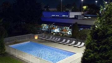 Seasonal outdoor pool, open 10:00 AM to 9:00 PM, pool umbrellas