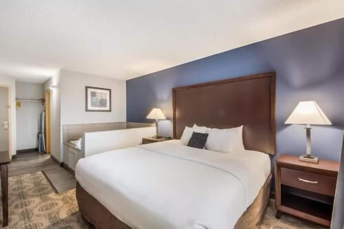 Premium bedding, desk, blackout drapes, iron/ironing board