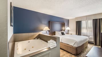 Suite, 1 King Bed, Jetted Tub | Premium bedding, desk, blackout drapes, iron/ironing board