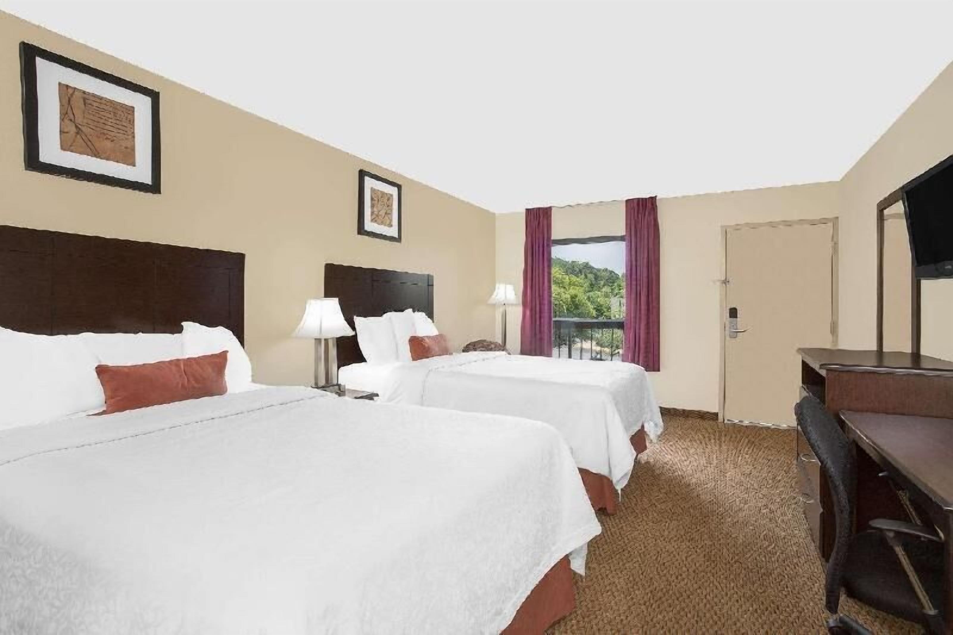 Premium bedding, blackout drapes, iron/ironing board