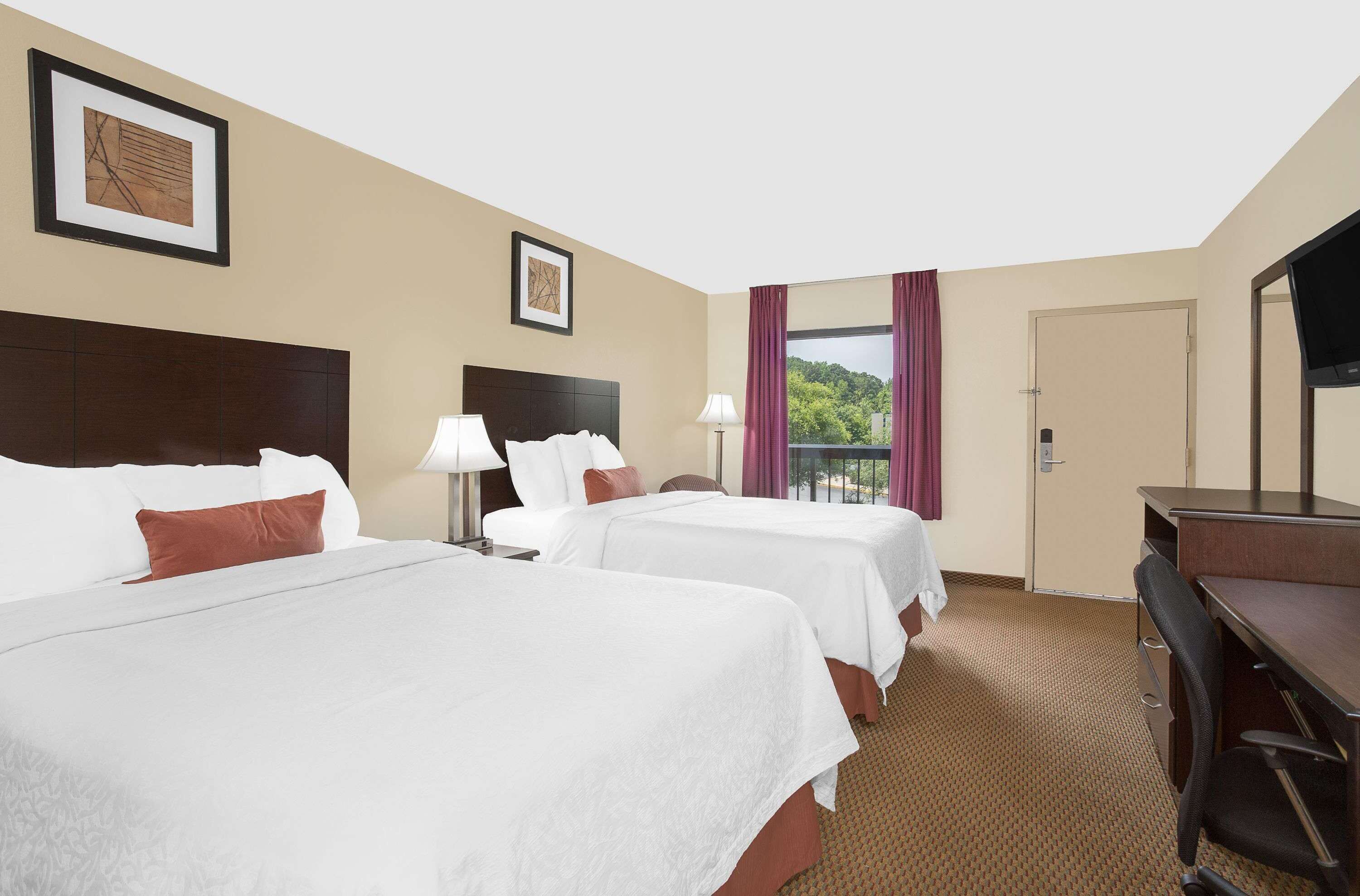Premium bedding, blackout drapes, iron/ironing board