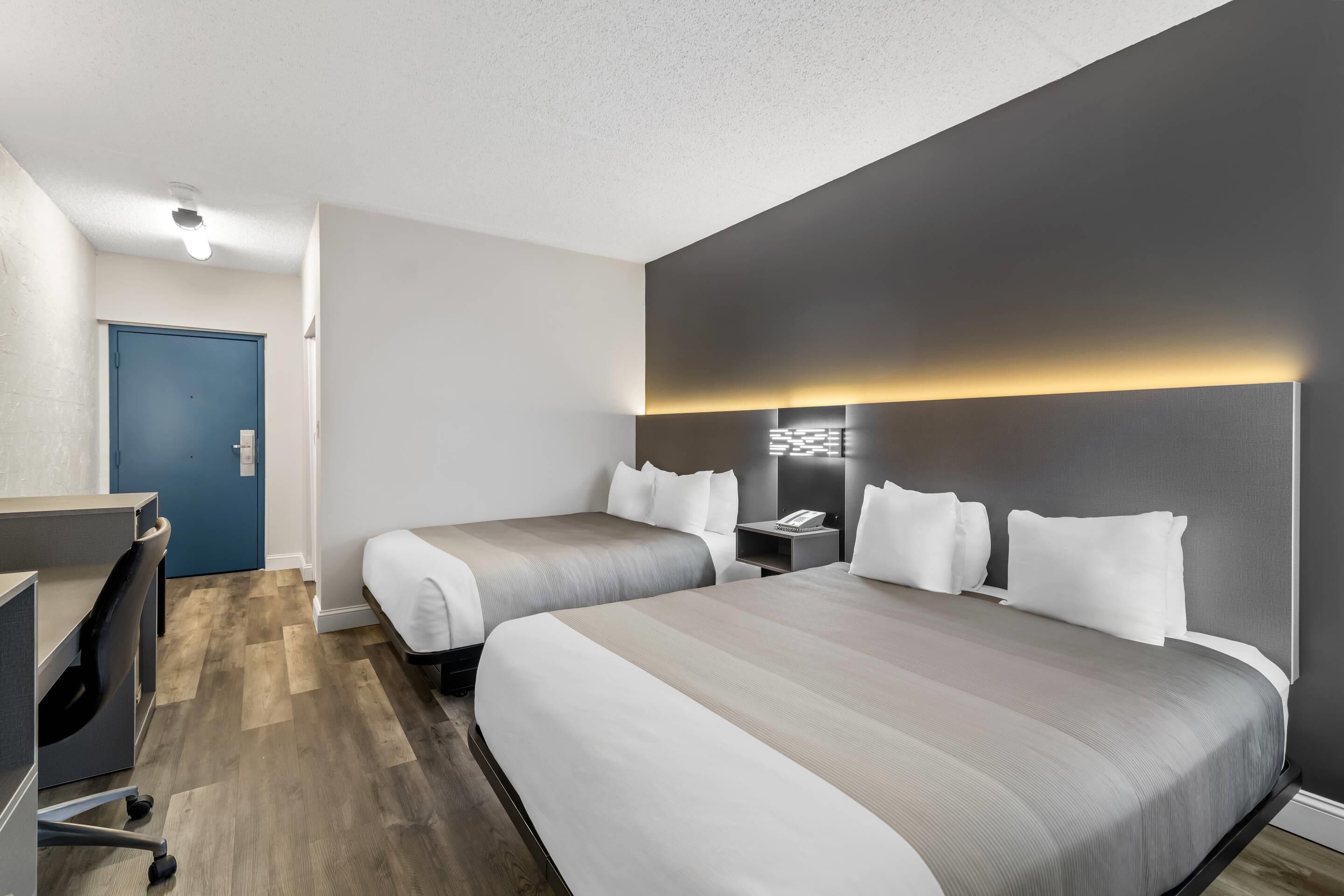 Desk, laptop workspace, blackout drapes, iron/ironing board