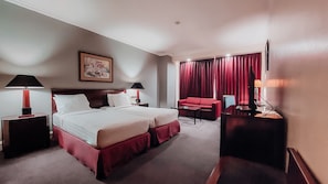 In-room safe, desk, blackout curtains, iron/ironing board - Surabaya Suites Hotel Powered by Archipelago (Surabaya)