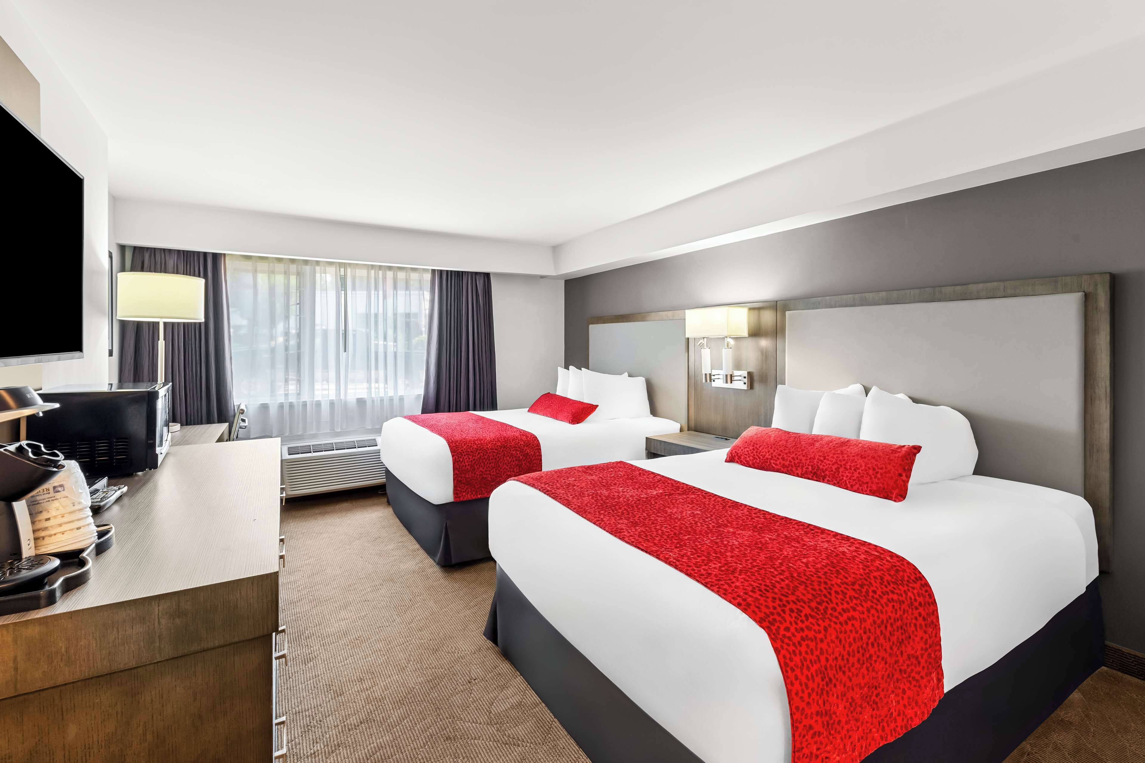 standard room, 2 queen beds, non smoking | laptop workspace, blackout curtains, soundproofing, iron/ironing board