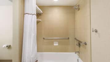 A bathroom with a bathtub, a shower, and a toilet.
