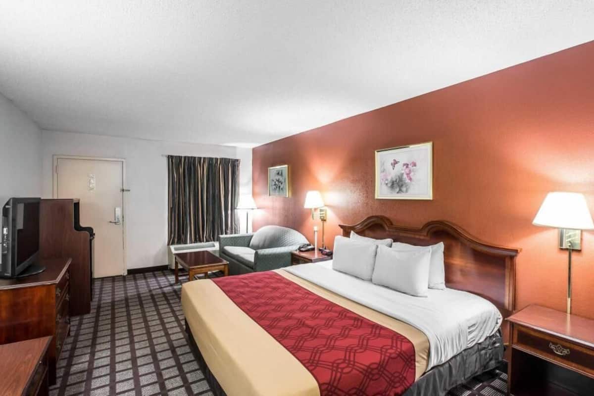 Desk, blackout drapes, iron/ironing board, rollaway beds