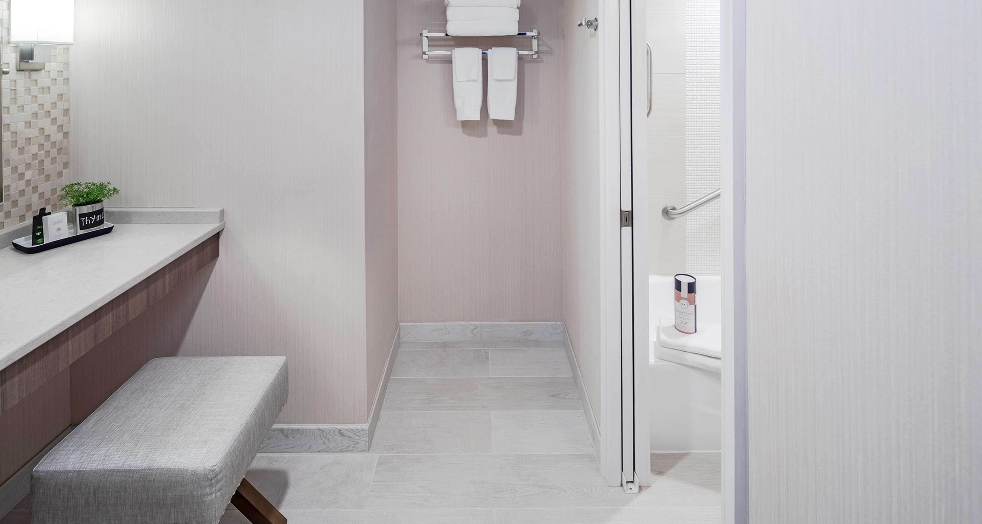 suite, 1 king bed, non smoking, refrigerator (living room;with sofabed) | bathroom | combined shower/bathtub, free toiletries, hair dryer, towels