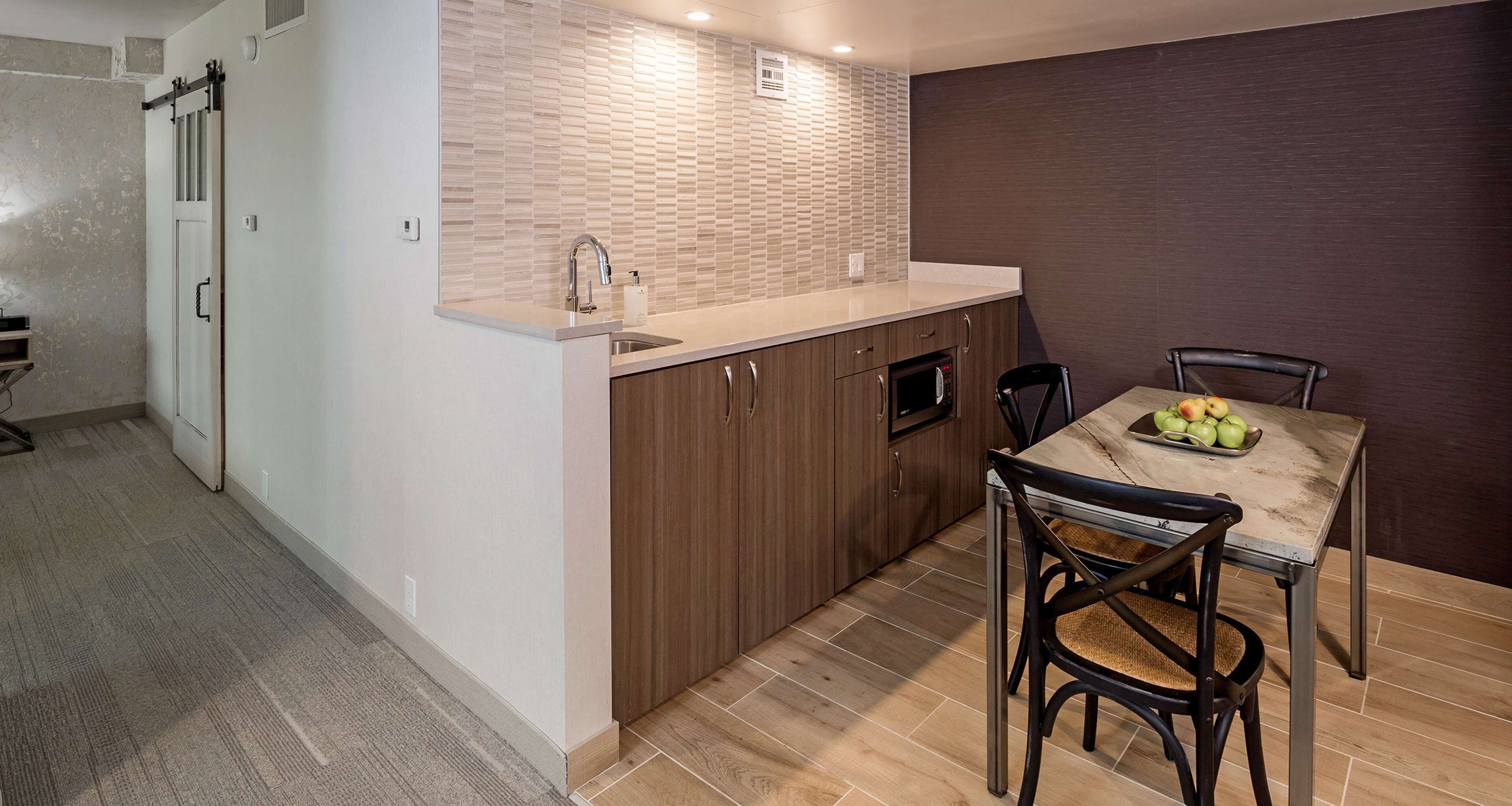 premium bedding, pillow-top beds, laptop workspace, iron/ironing board