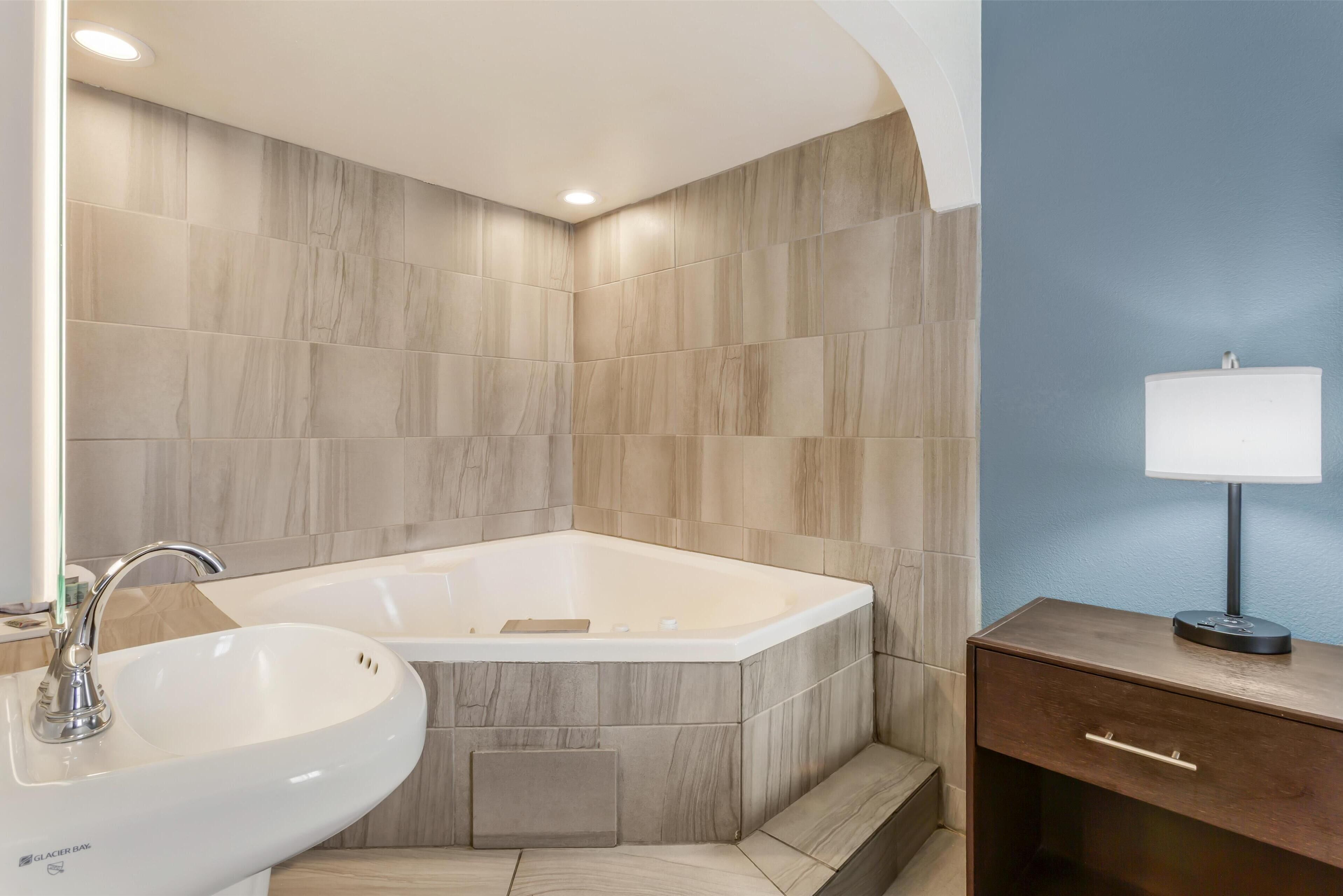 Suite, 1 King Bed, Non Smoking, Jetted Tub (with Sofabed) | Bathroom | Combined shower/tub, free toiletries, hair dryer, towels