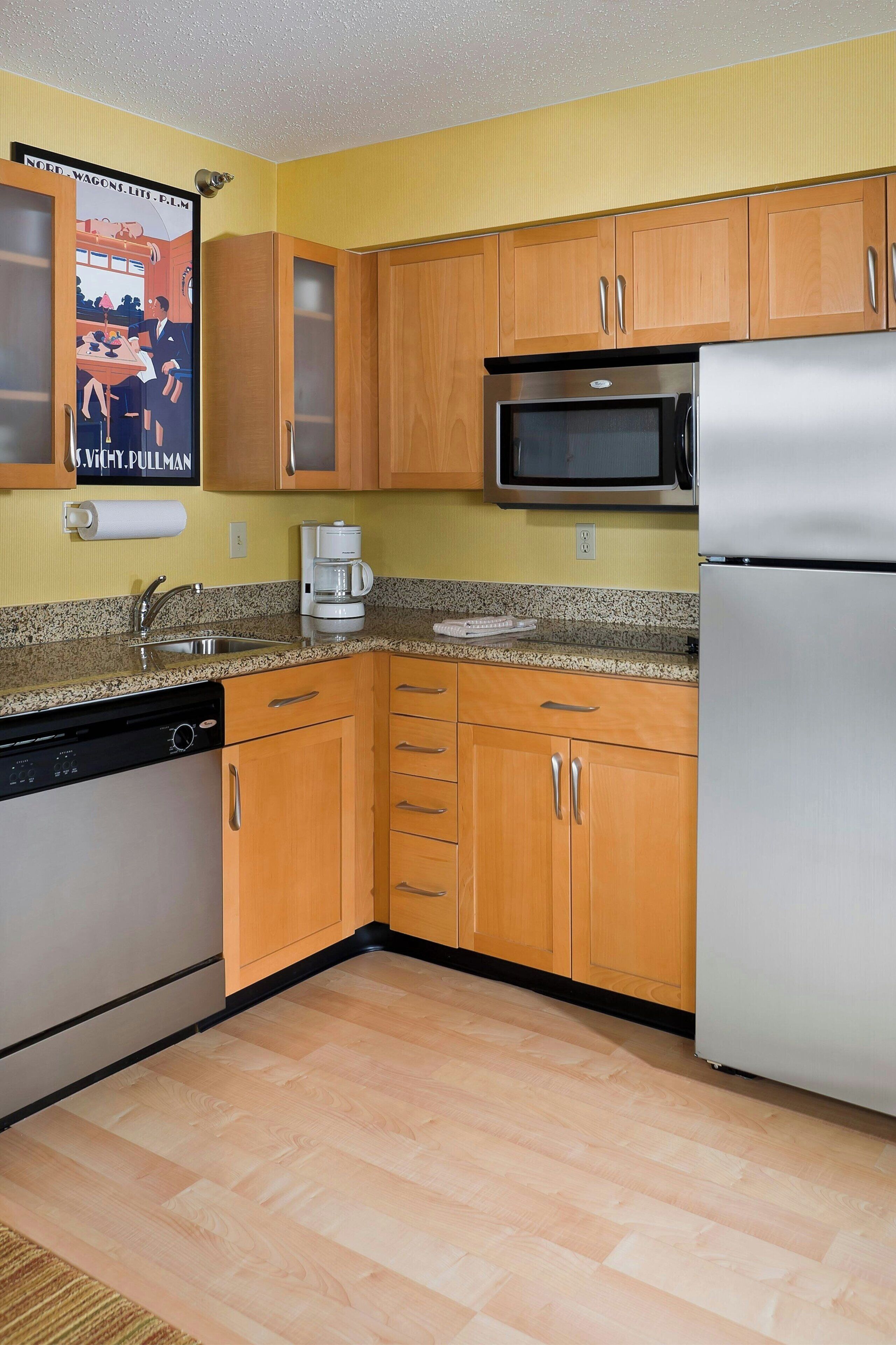 full-sized fridge, microwave, stovetop, dishwasher