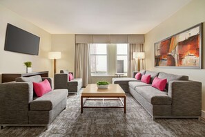 Suite, 1 King Bed with Sofa bed | Living area | 42-inch TV with cable channels, DVD player