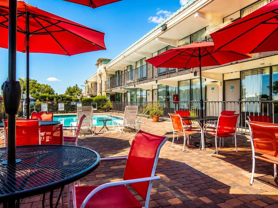 Seasonal outdoor pool, open 10:00 AM to 9:00 PM, pool umbrellas