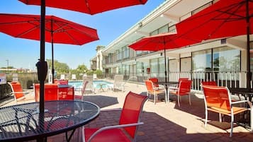 Seasonal outdoor pool, open 10:00 AM to 9:00 PM, pool umbrellas