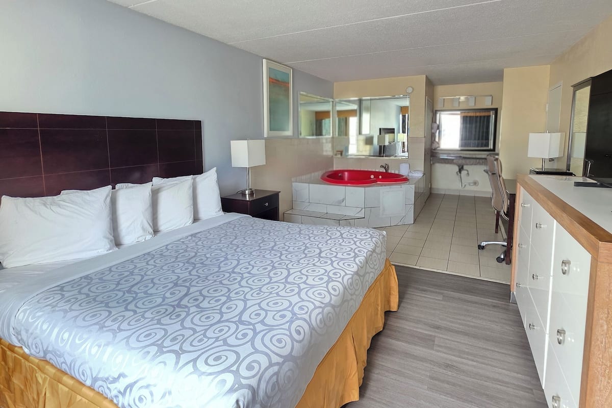 Chambre Simple, 1 trÚs grand lit, non-fumeurs, baignoire à jets | Literie de qualité supérieure, surmatelas