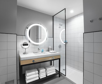 Designer toiletries, hair dryer, towels, soap at Downtown Grand Las Vegas