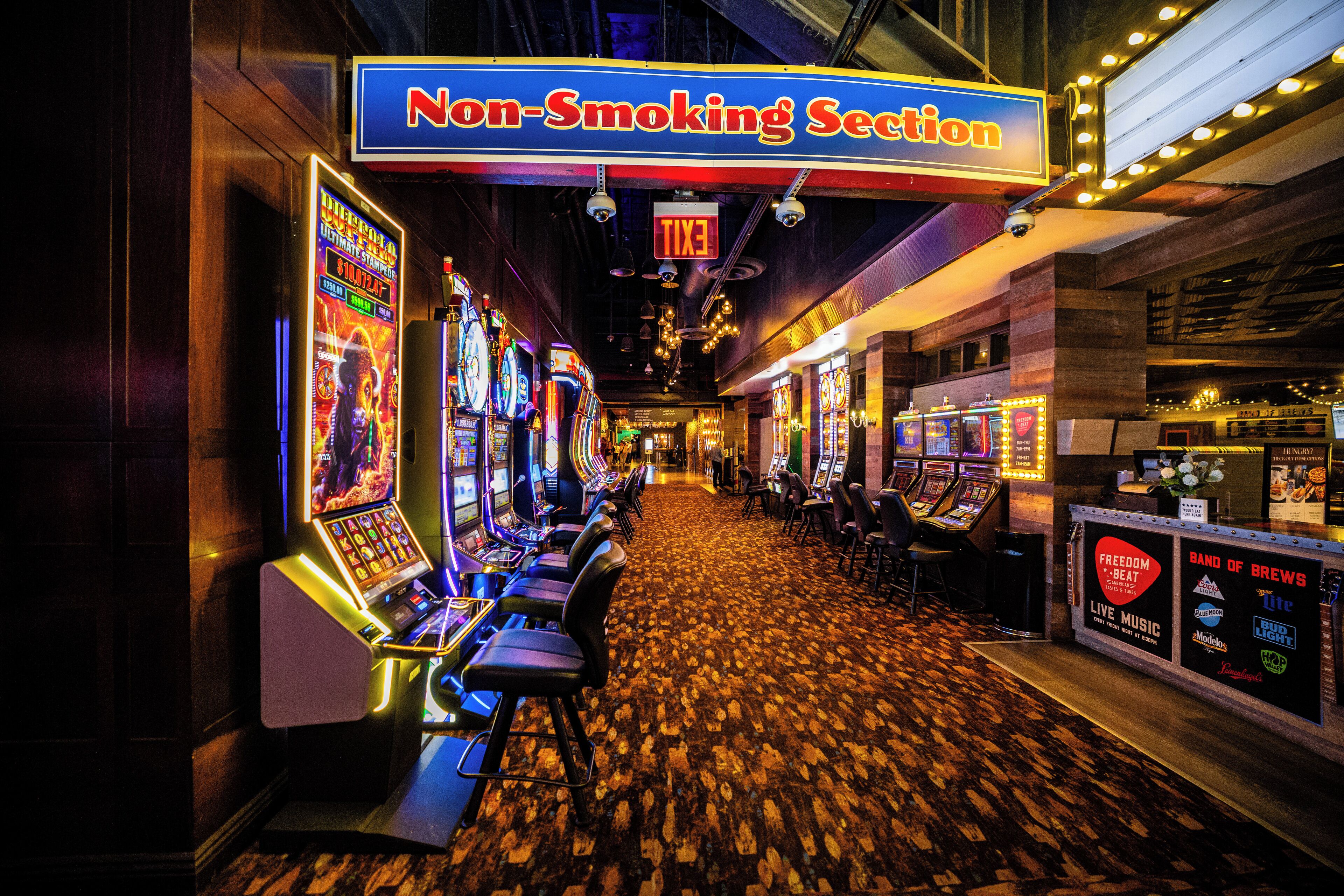 A non-smoking section with arcade machines and a live music bar.