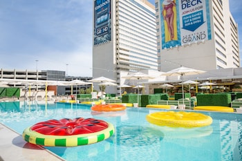 Outdoor pool, cabanas (surcharge), pool umbrellas at Downtown Grand Las Vegas