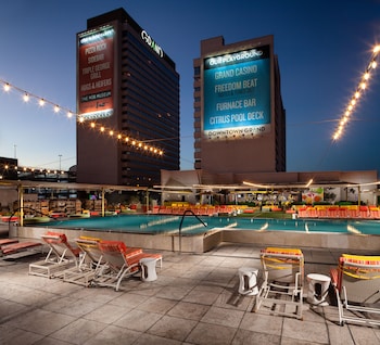 Outdoor pool, cabanas (surcharge), pool umbrellas at Downtown Grand Las Vegas