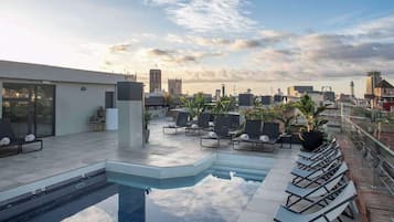 Outdoor pool, open 10:00 AM to 8:00 PM, pool umbrellas, sun loungers