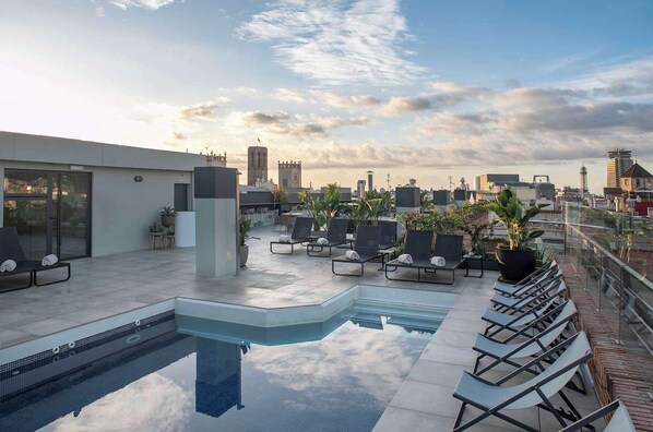 Outdoor pool, open 10:00 AM to 8:00 PM, pool umbrellas, sun loungers