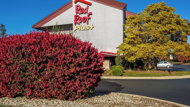 A building with a sign reading "Red Roof Plus". - Red Roof Inn PLUS+ Chicago - Hoffman Estates (Hoffman Estates)