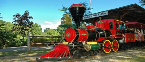 A vintage steam locomotive at Riverview Park Railway station.