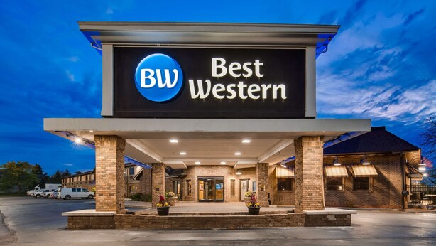 A hotel with a prominent 'BW Best Western' sign, a covered entrance, and a brick facade. - Best Western Lapeer Inn (Lapeer)