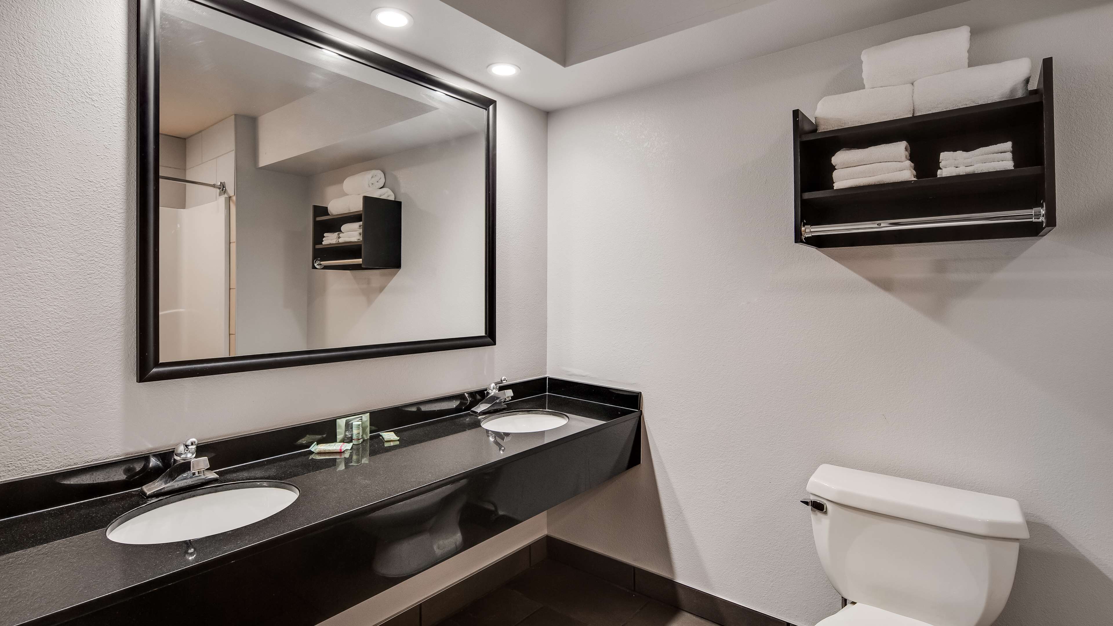 designer toiletries, hair dryer, towels, soap