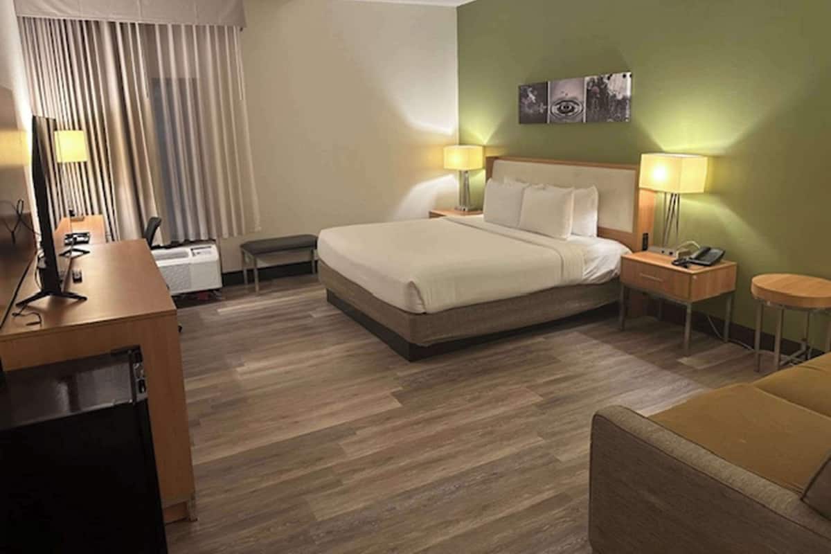 suite, 1 king bed, non smoking | premium bedding, desk, iron/ironing board, free rollaway beds