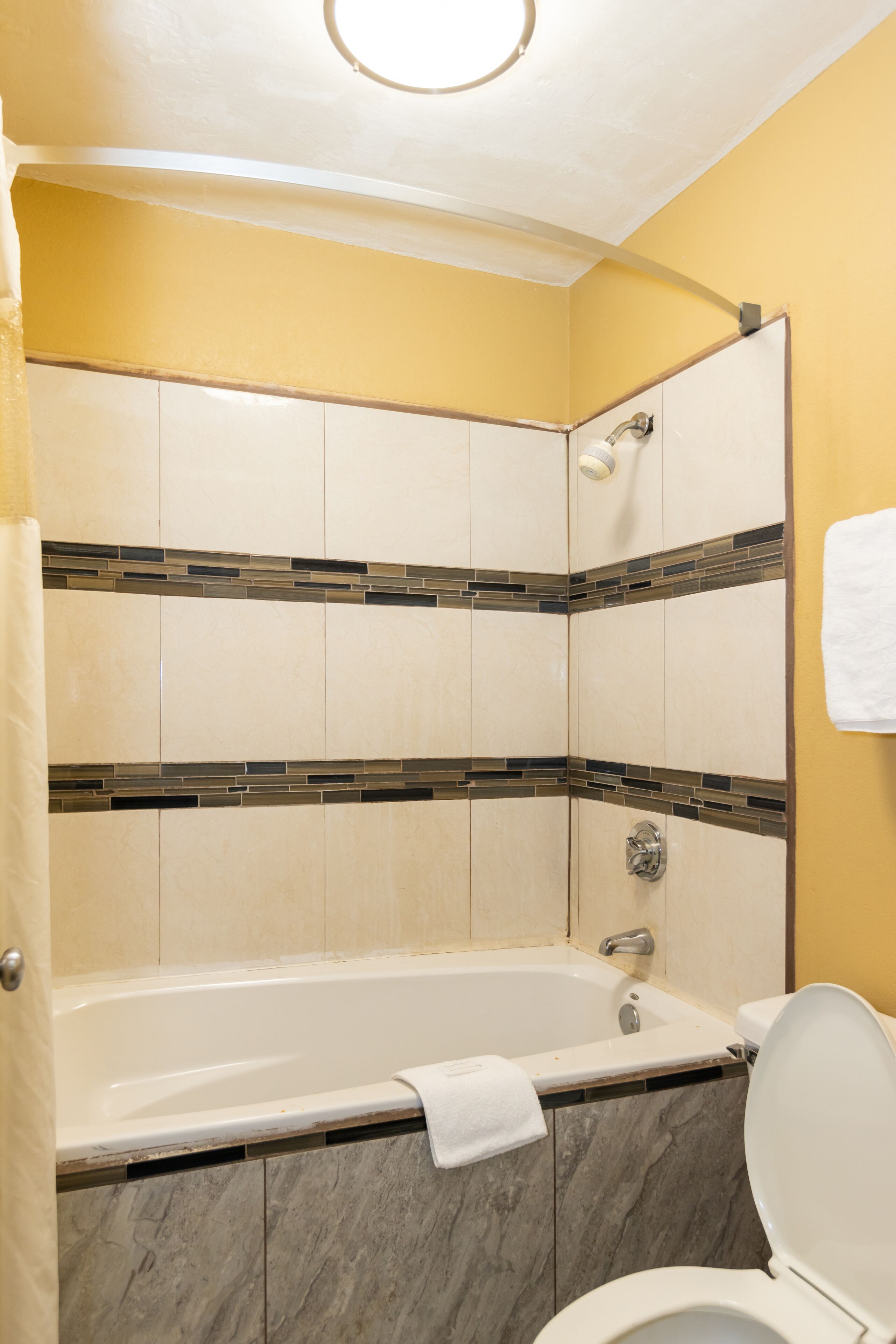 Studio Suite, 1 King Bed, Smoking | Bathroom | Combined shower/bathtub, hair dryer, towels