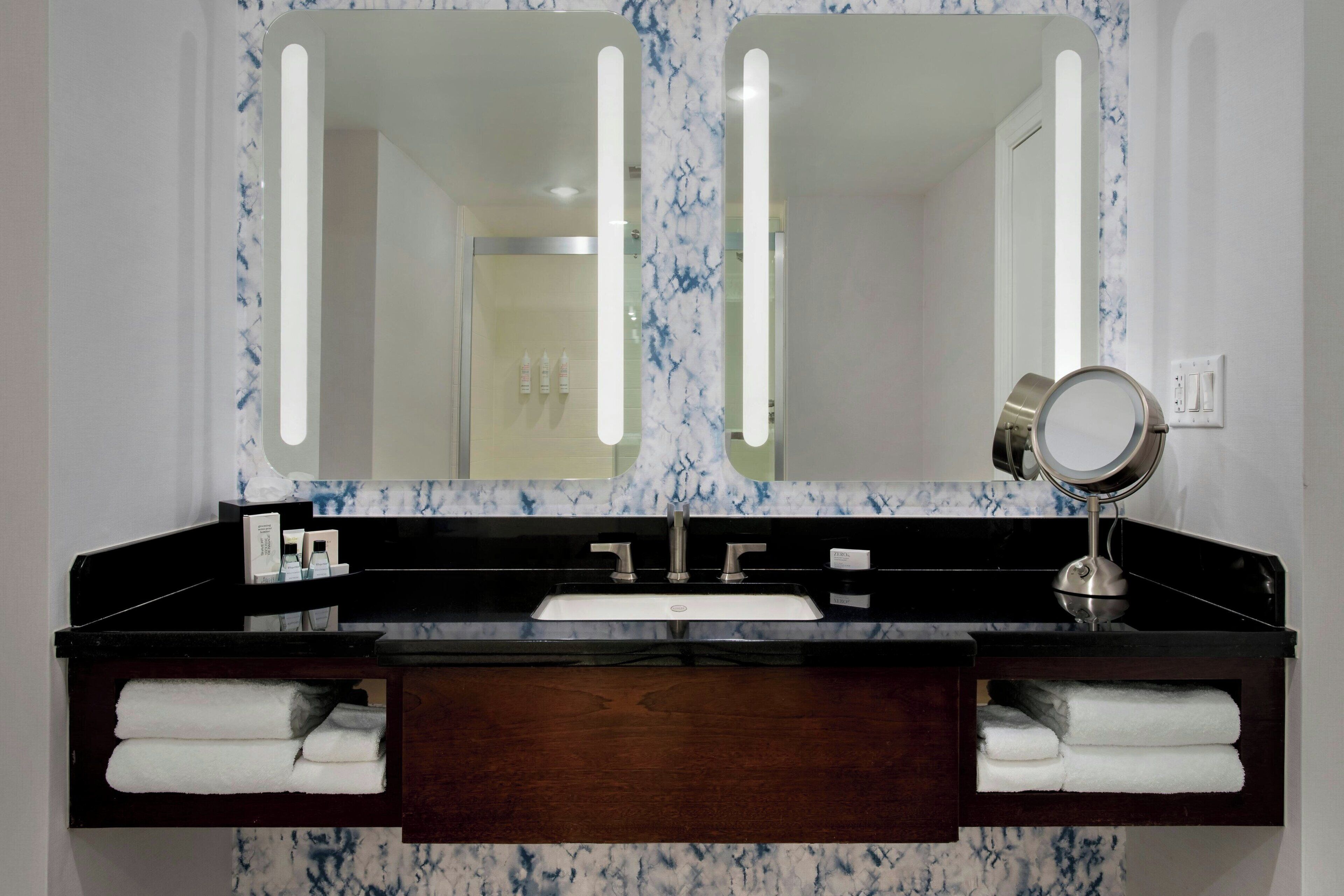 designer toiletries, hair dryer, towels, soap