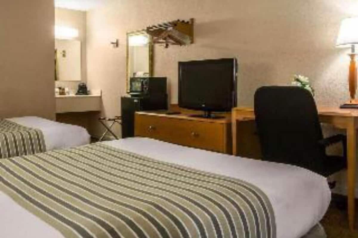 Premium bedding, desk, blackout drapes, iron/ironing board