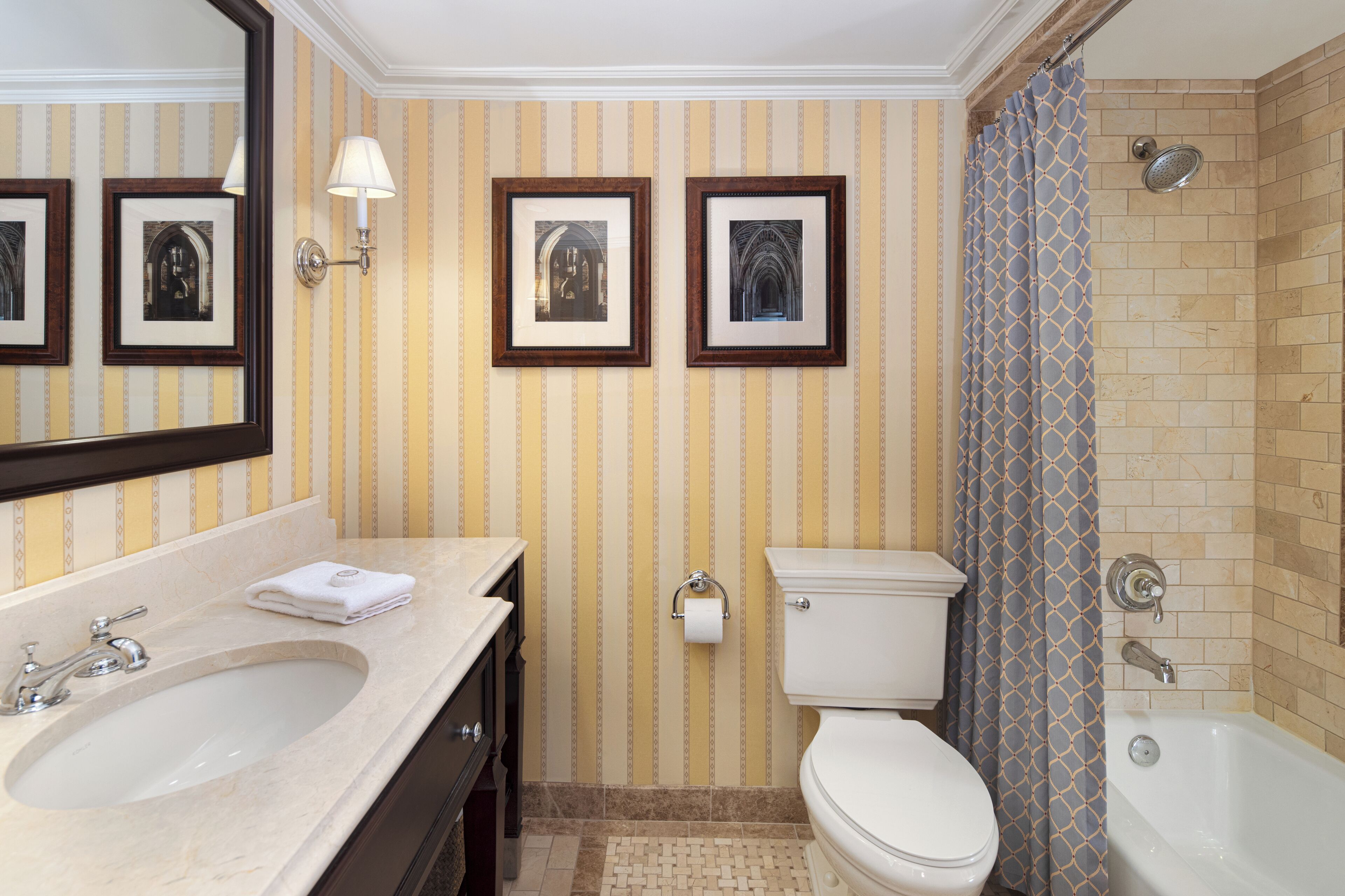 combined shower/bathtub, designer toiletries, hair dryer, bathrobes