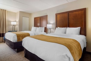 Premium bedding, desk, laptop workspace, blackout curtains