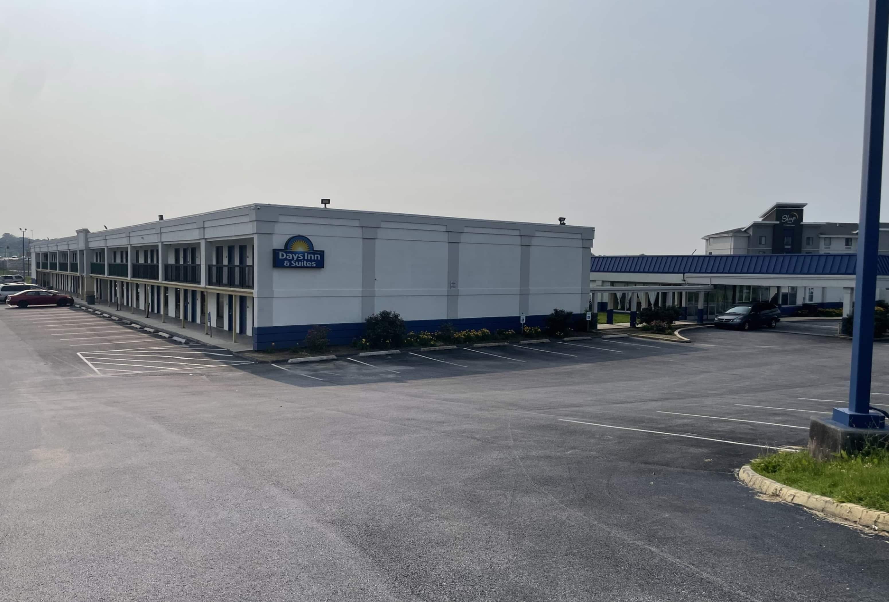 A Days Inn building with a parking lot in front.