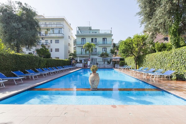 Seasonal outdoor pool, pool umbrellas, pool loungers