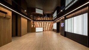 A spacious, modern lobby with wooden paneling and a central seating area. - Shinjuku Prince Hotel (Tokyo)