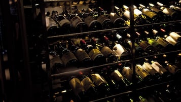 A wine rack with multiple bottles.