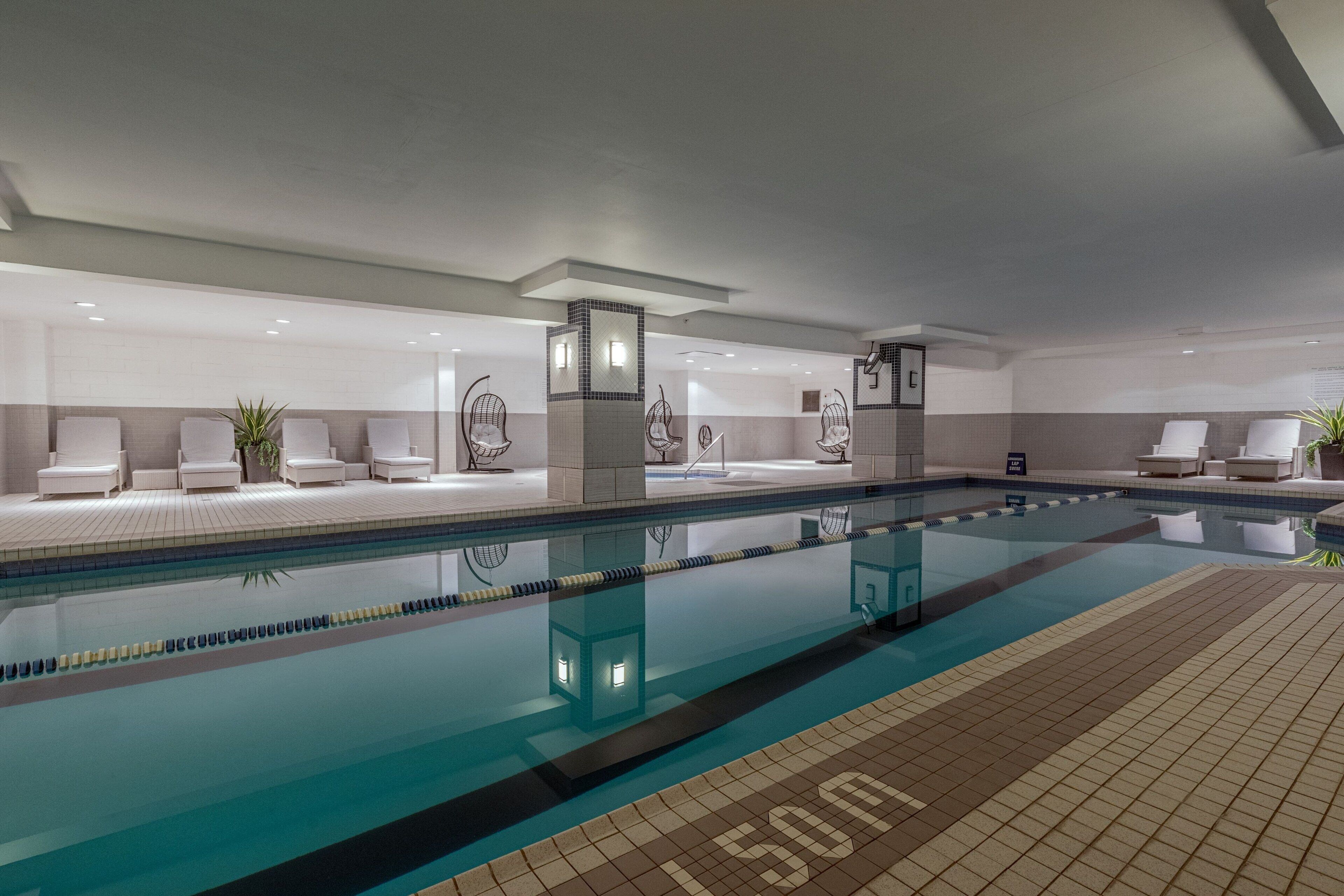 indoor pool, pool loungers, lifeguards on site